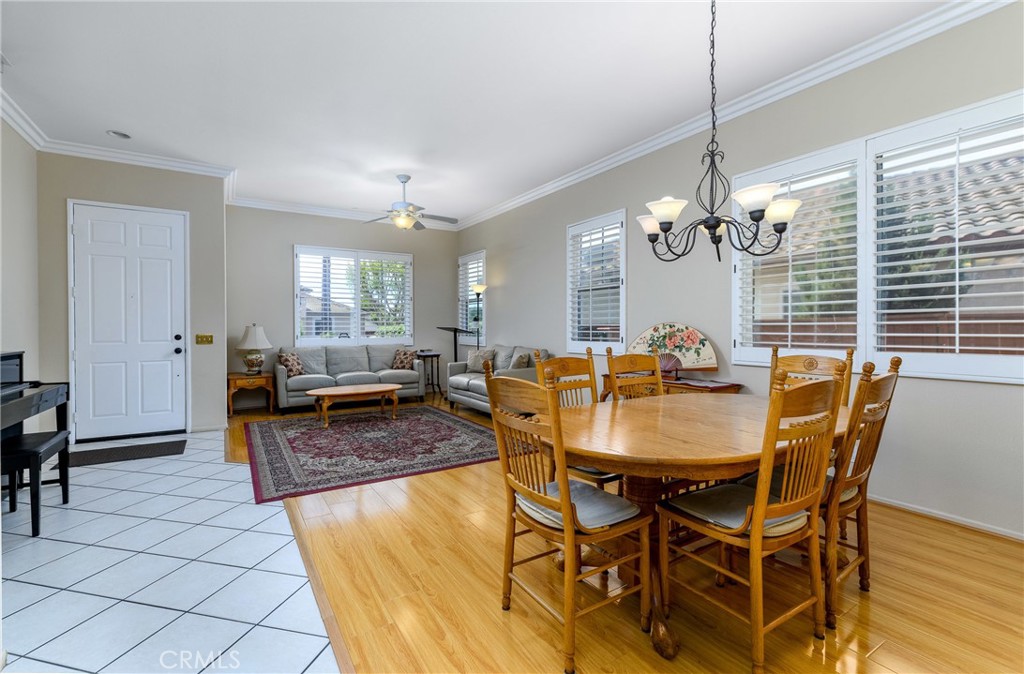 41783 Niblick Road Temecula, CA 92591 - Photo 15 of 33 a view of a dining room with furniture and a chandelier