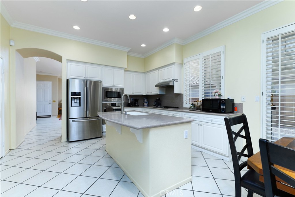 41783 Niblick Road Temecula, CA 92591 - Photo 17 of 33 a kitchen with stainless steel appliances a refrigerator sink and microwave