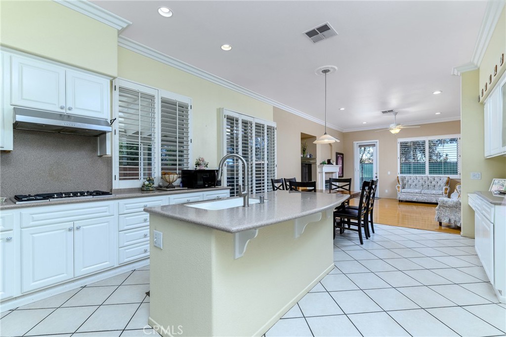 41783 Niblick Road Temecula, CA 92591 - Photo 19 of 33 a kitchen with cabinets and chairs