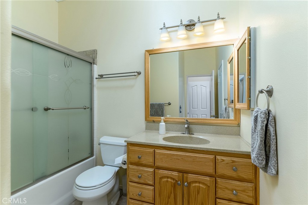 41783 Niblick Road Temecula, CA 92591 - Photo 27 of 33 a bathroom with a granite countertop sink toilet and shower