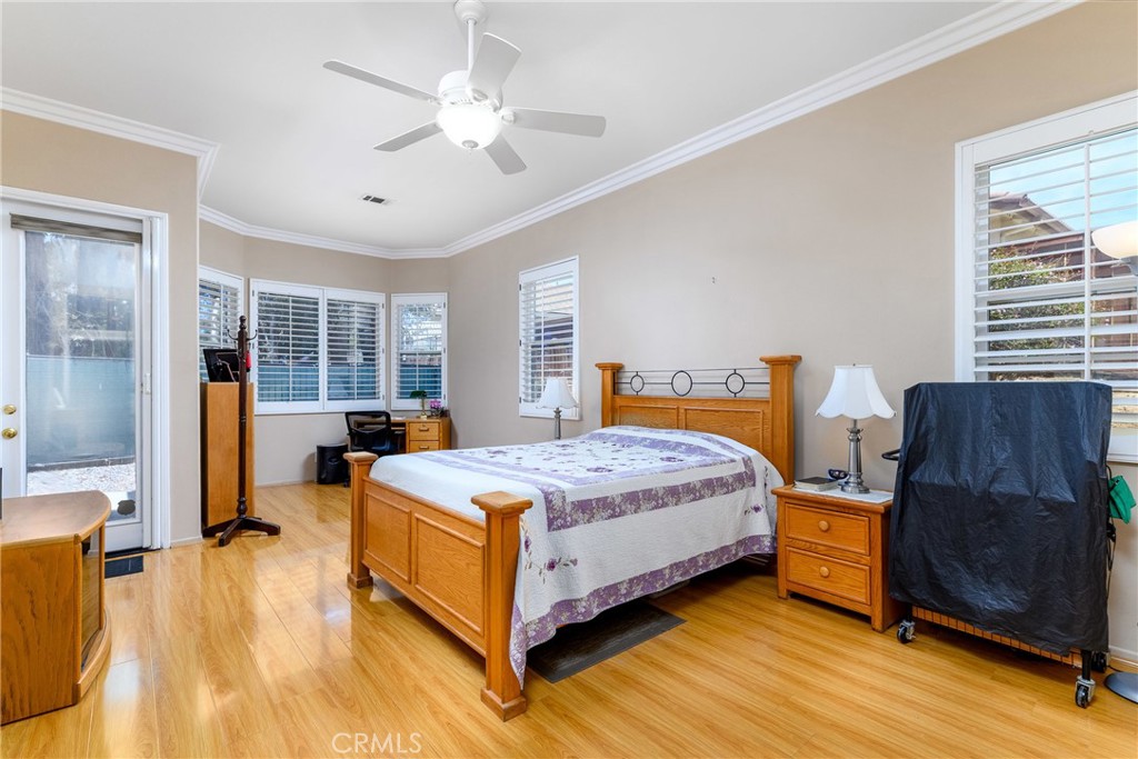 41783 Niblick Road Temecula, CA 92591 - Photo 29 of 33 a bedroom with a bed and wooden floor