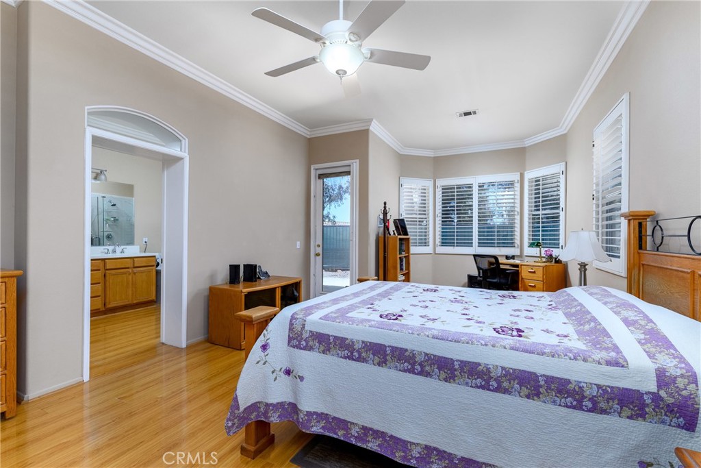 41783 Niblick Road Temecula, CA 92591 - Photo 30 of 33 a bed room with a bed a desk and chair