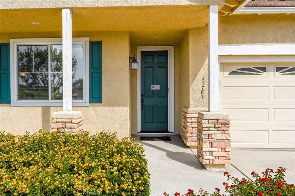 41783 Niblick Road Temecula, CA 92591 - Photo 5 of 33 a front view of a house with a garage