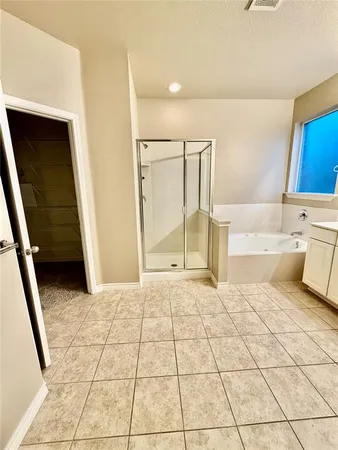 a view of an empty room and entrance door