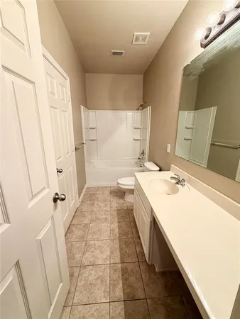 a bathroom with a sink a mirror and a bathtub