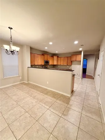 a view of a kitchen with a sink and cabinets