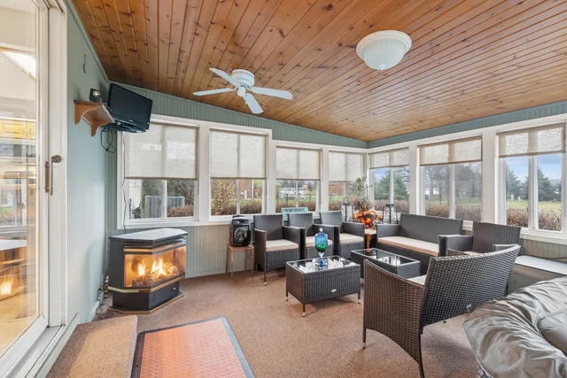 a bedroom with a bed a couch and dresser