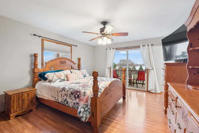a view of a backyard with plants and lake view
