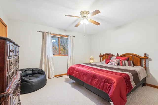 a view of a livingroom with workspace and a couch