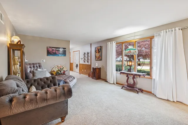 a bed room with furniture and a window