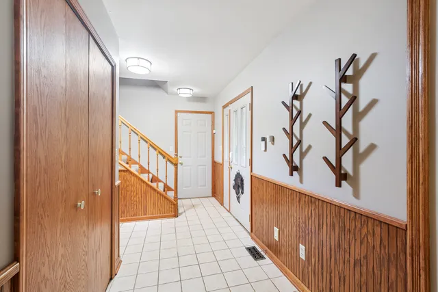 a view of a hallway with stairs