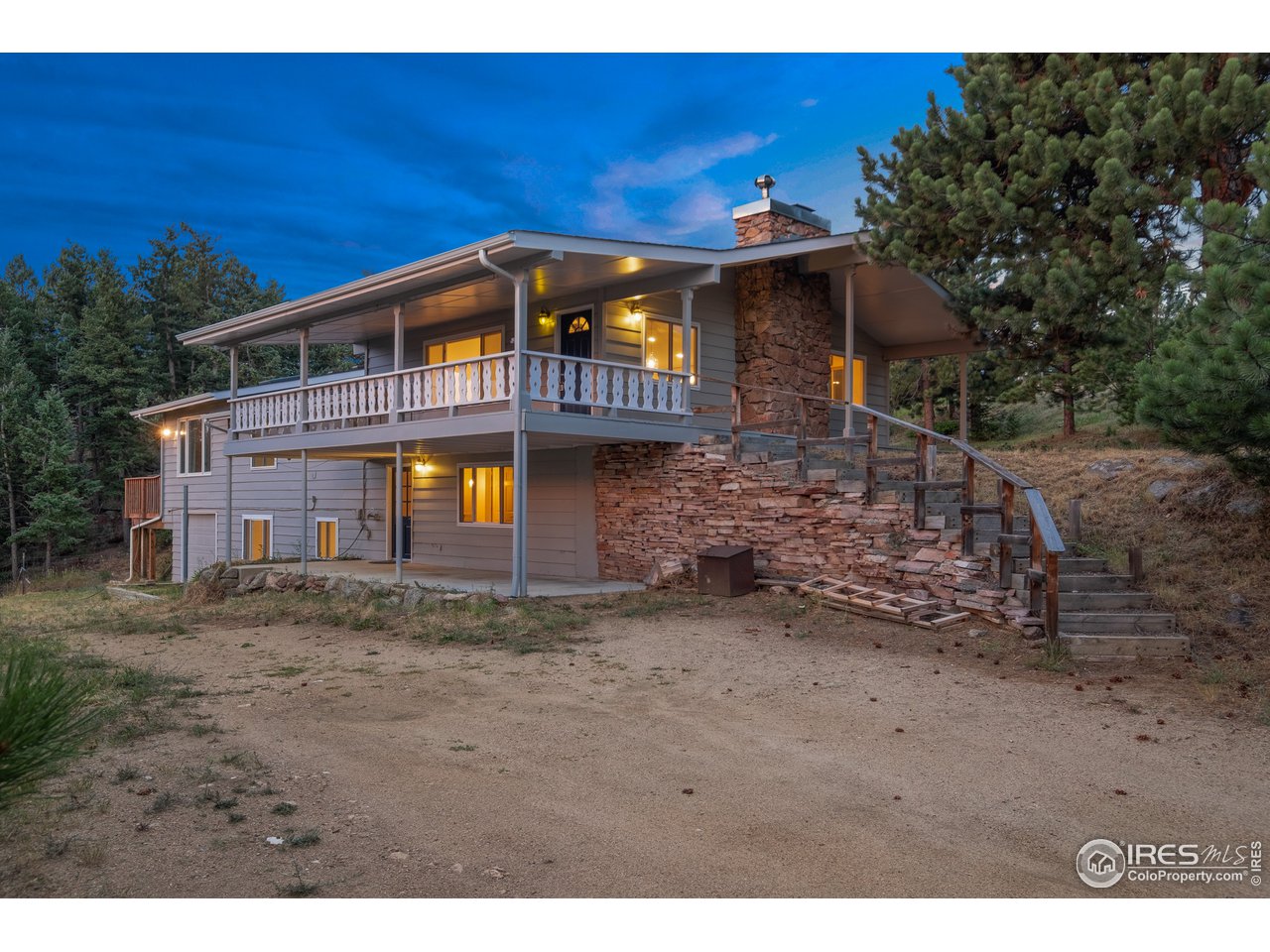1073 Deer Trail Road Boulder, CO 80302 - Photo 1 of 32 a front view of a house with a yard