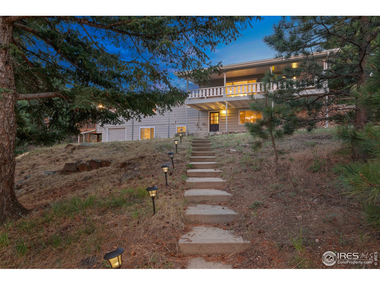 1073 Deer Trail Road Boulder, CO 80302 - Photo 2 of 32 a view of a yard with a tree