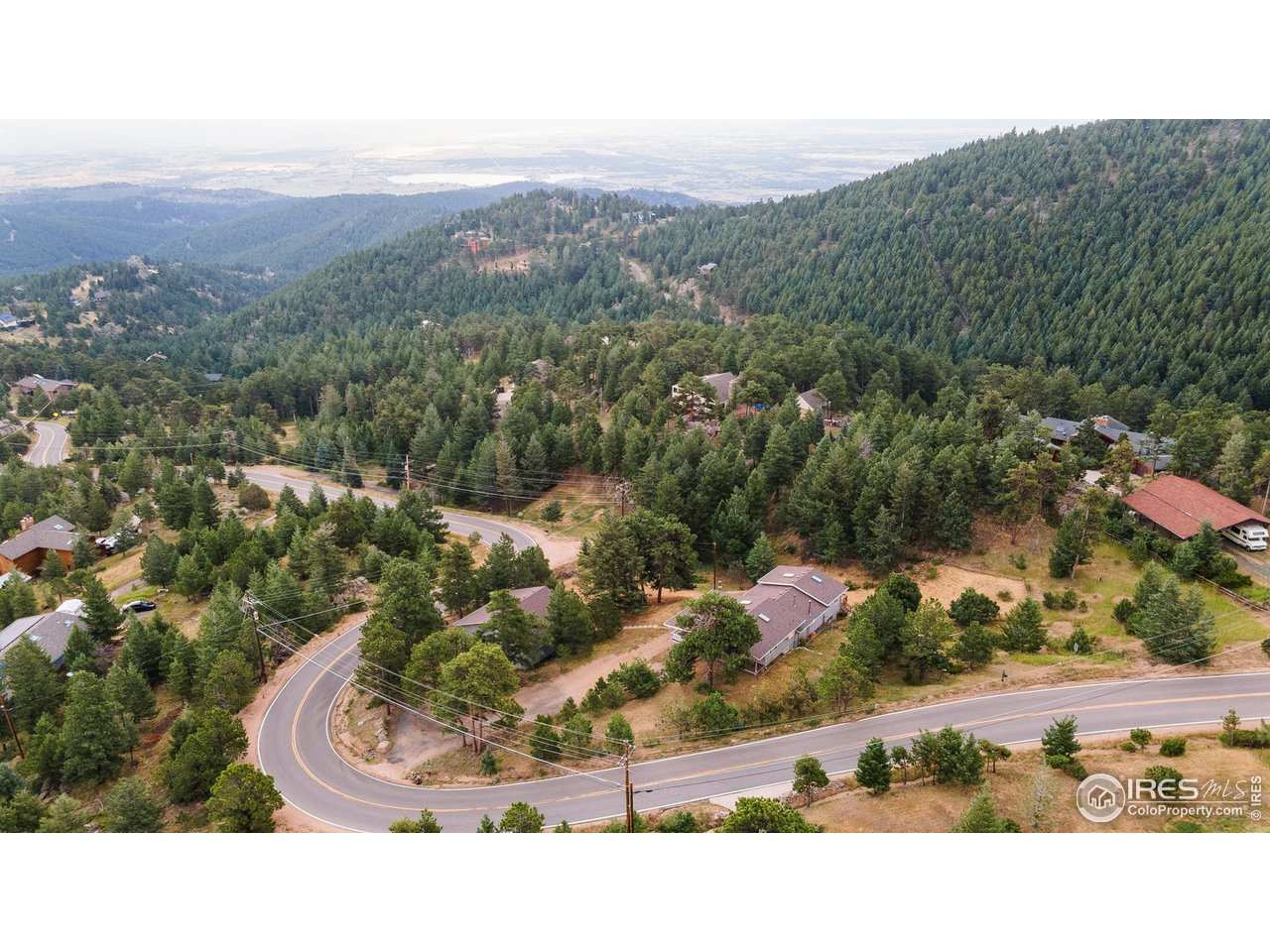 1073 Deer Trail Road Boulder, CO 80302 - Photo 29 of 32 a view of a city with mountains in the background