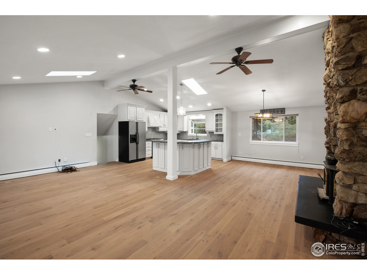 1073 Deer Trail Road Boulder, CO 80302 - Photo 5 of 32 a view of empty room with wooden floor and window