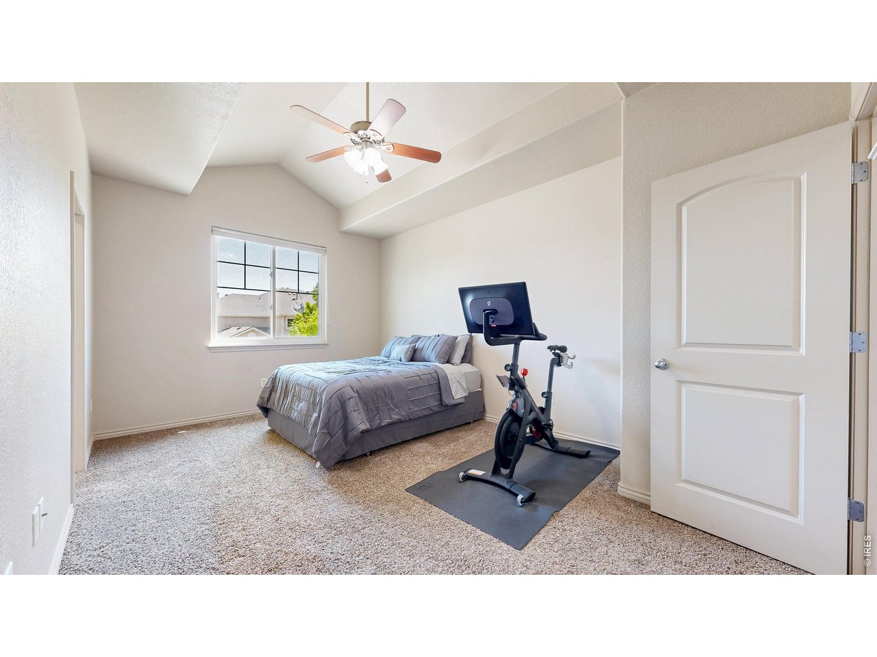 4672 West 20th Road, Unit 413 Greeley, CO 80634 - Photo 24 of 37 a living room with a bed furniture and a window