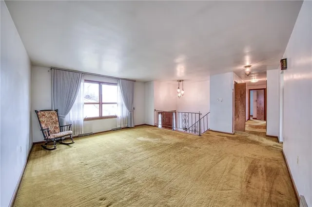 a kitchen with stainless steel appliances granite countertop a sink a stove cabinets and wooden floor