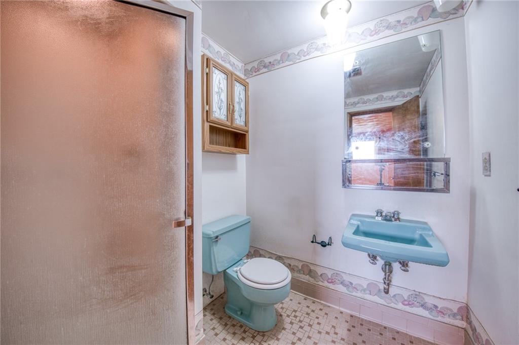 219 Center New Texas Road Pittsburgh, PA 15239 - Photo 32 of 35 a bathroom with a toilet and a shower