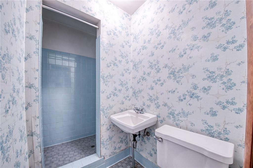 219 Center New Texas Road Pittsburgh, PA 15239 - Photo 33 of 35 a bathroom with a sink and a toilet