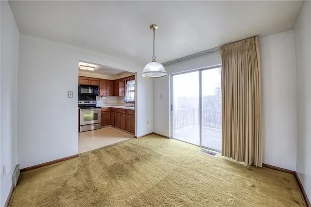 a view of a kitchen and window