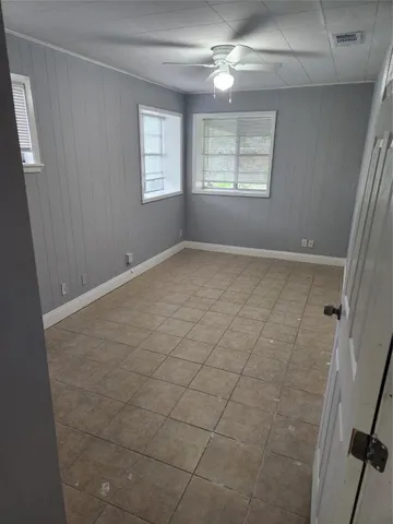 a view of an empty room and window