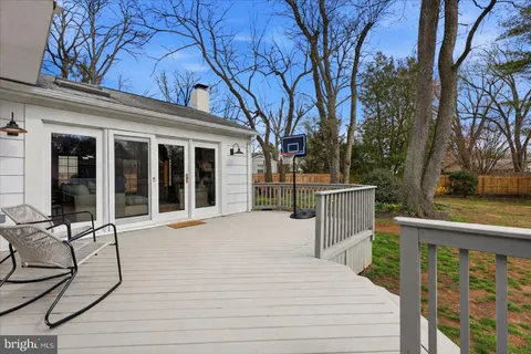 a view of a house with wooden fence