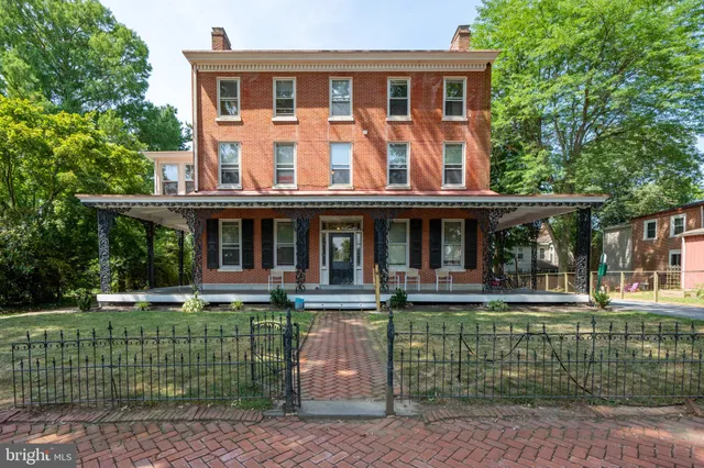 front view of a house with a garden