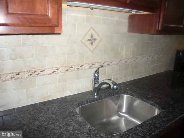 a bathroom with a sink and a shower
