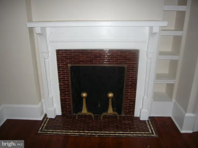 a living room with fireplace