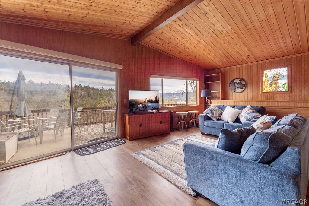 1179 Ridge Road Fawnskin, CA 92333 - Photo 13 of 43 a living room with furniture and a floor to ceiling window