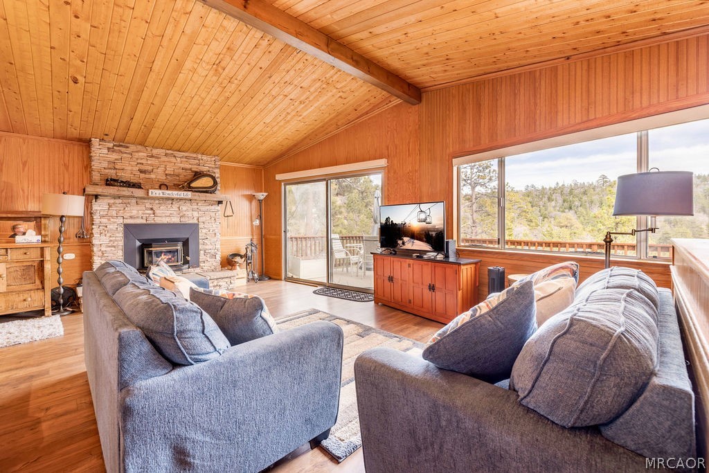 1179 Ridge Road Fawnskin, CA 92333 - Photo 15 of 43 a living room with furniture fireplace and a large window