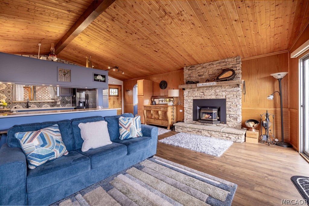 1179 Ridge Road Fawnskin, CA 92333 - Photo 16 of 43 a living room with furniture and a fireplace