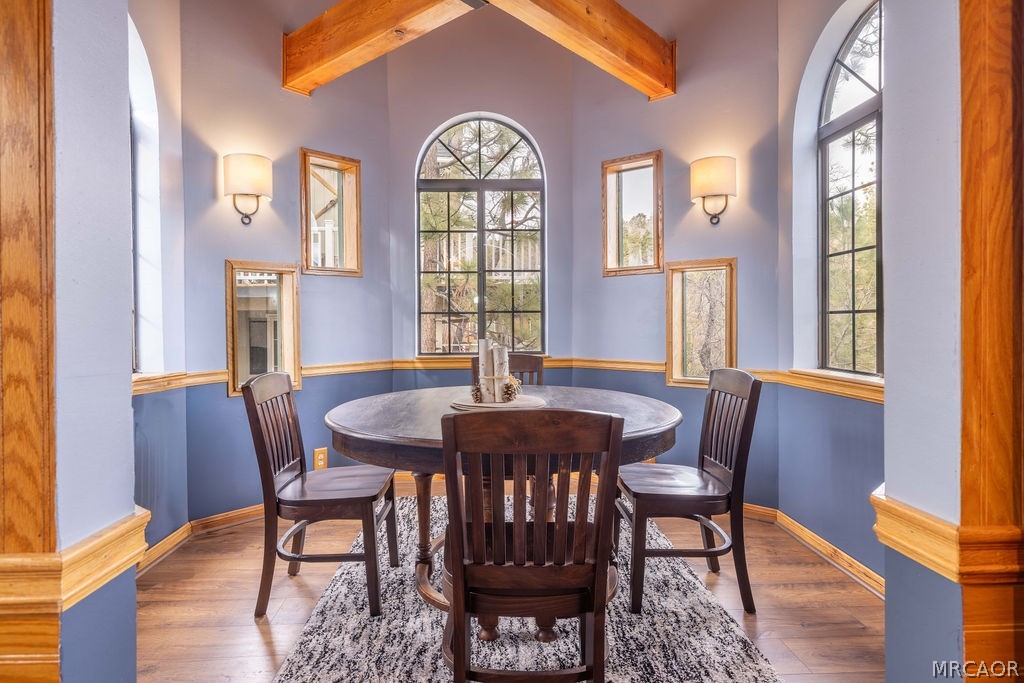 1179 Ridge Road Fawnskin, CA 92333 - Photo 22 of 43 a view of a a dining room with furniture window and wooden floor