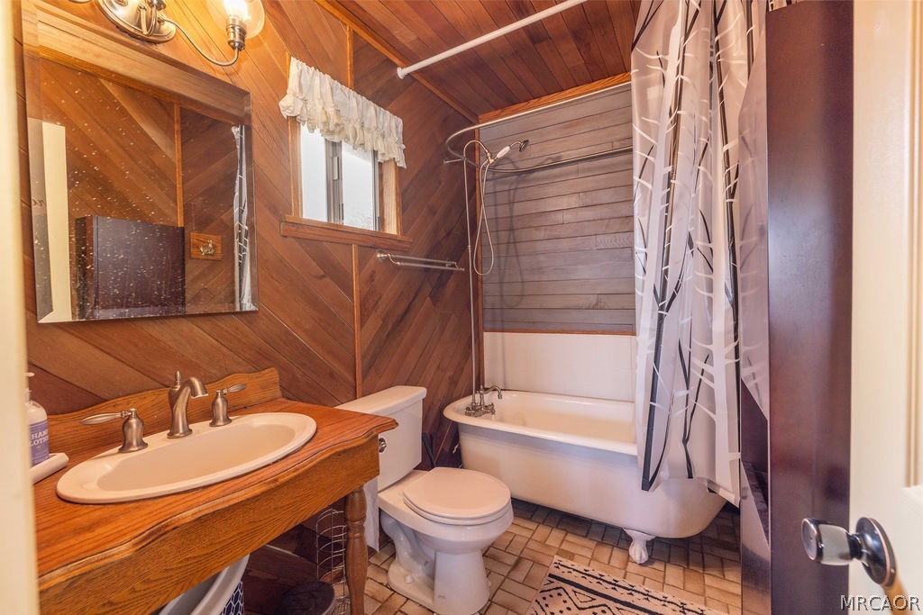 1179 Ridge Road Fawnskin, CA 92333 - Photo 24 of 43 a bathroom with a sink toilet and shower