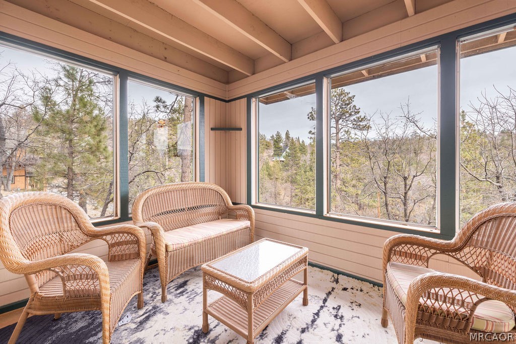 1179 Ridge Road Fawnskin, CA 92333 - Photo 29 of 43 a living room with furniture and a floor to ceiling window