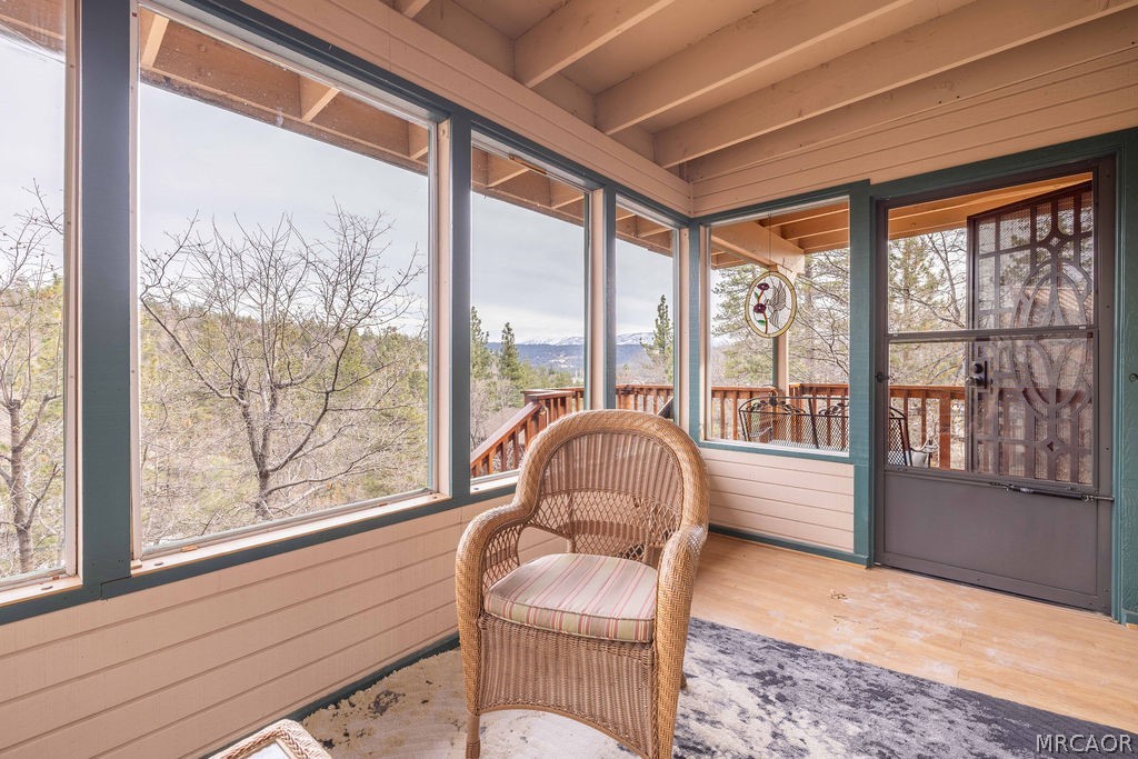 1179 Ridge Road Fawnskin, CA 92333 - Photo 31 of 43 a living room with furniture and floor to ceiling windows