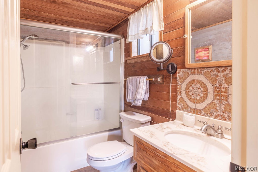 1179 Ridge Road Fawnskin, CA 92333 - Photo 32 of 43 a bathroom with a sink a toilet and shower