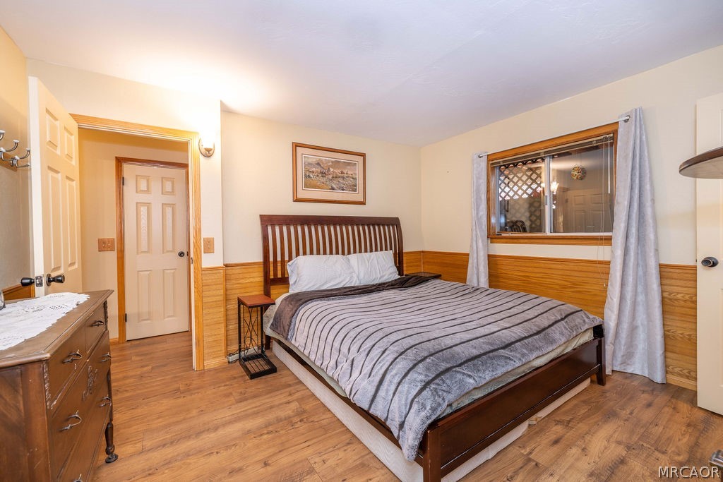 1179 Ridge Road Fawnskin, CA 92333 - Photo 34 of 43 a bedroom with bed and window