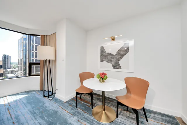a view of a livingroom with furniture and a table
