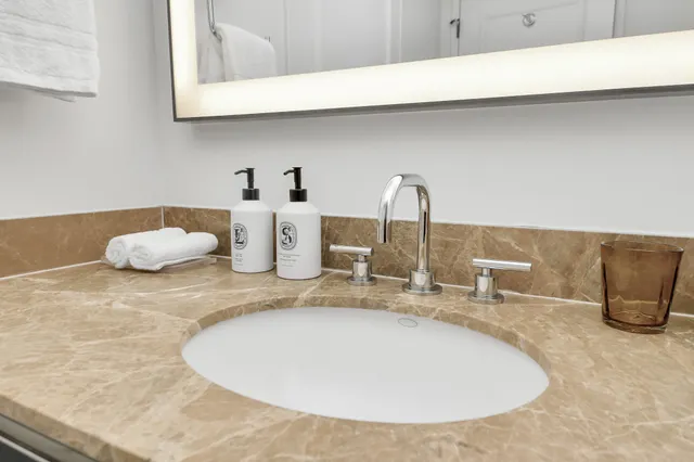 a bathroom with a sink and a mirror