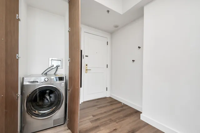 a view of a hallway with washer and dryer