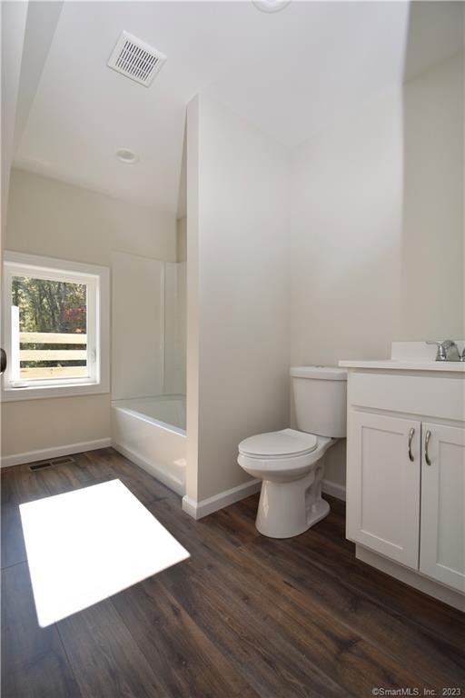 329 Main Street, Unit 3 Plymouth, CT 06786 - Photo 11 of 11 a bathroom with a toilet and a window