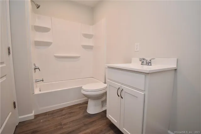 a bathroom with a sink toilet and vanity