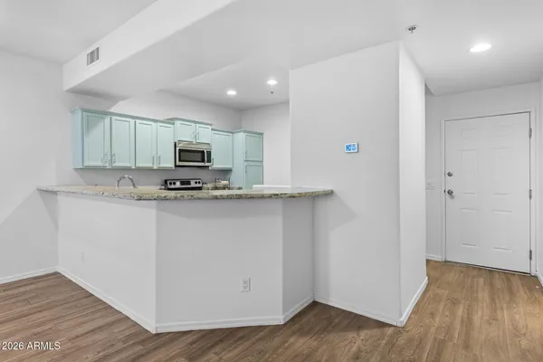 a view of a kitchen with a sink and dishwasher