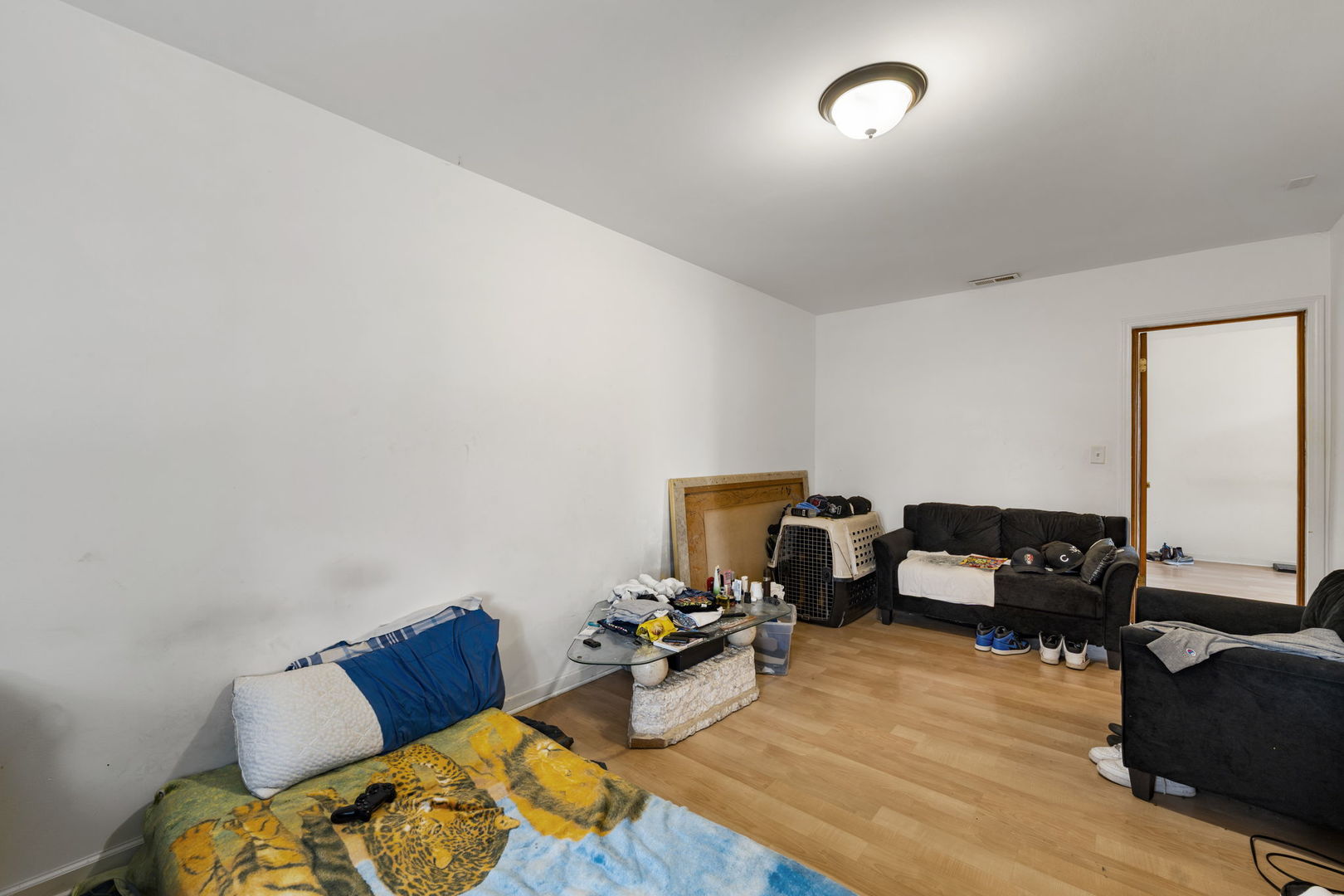 6021 South Archer Road Summit, IL 60501 - Photo 14 of 40 a bedroom with furniture and a wooden floor