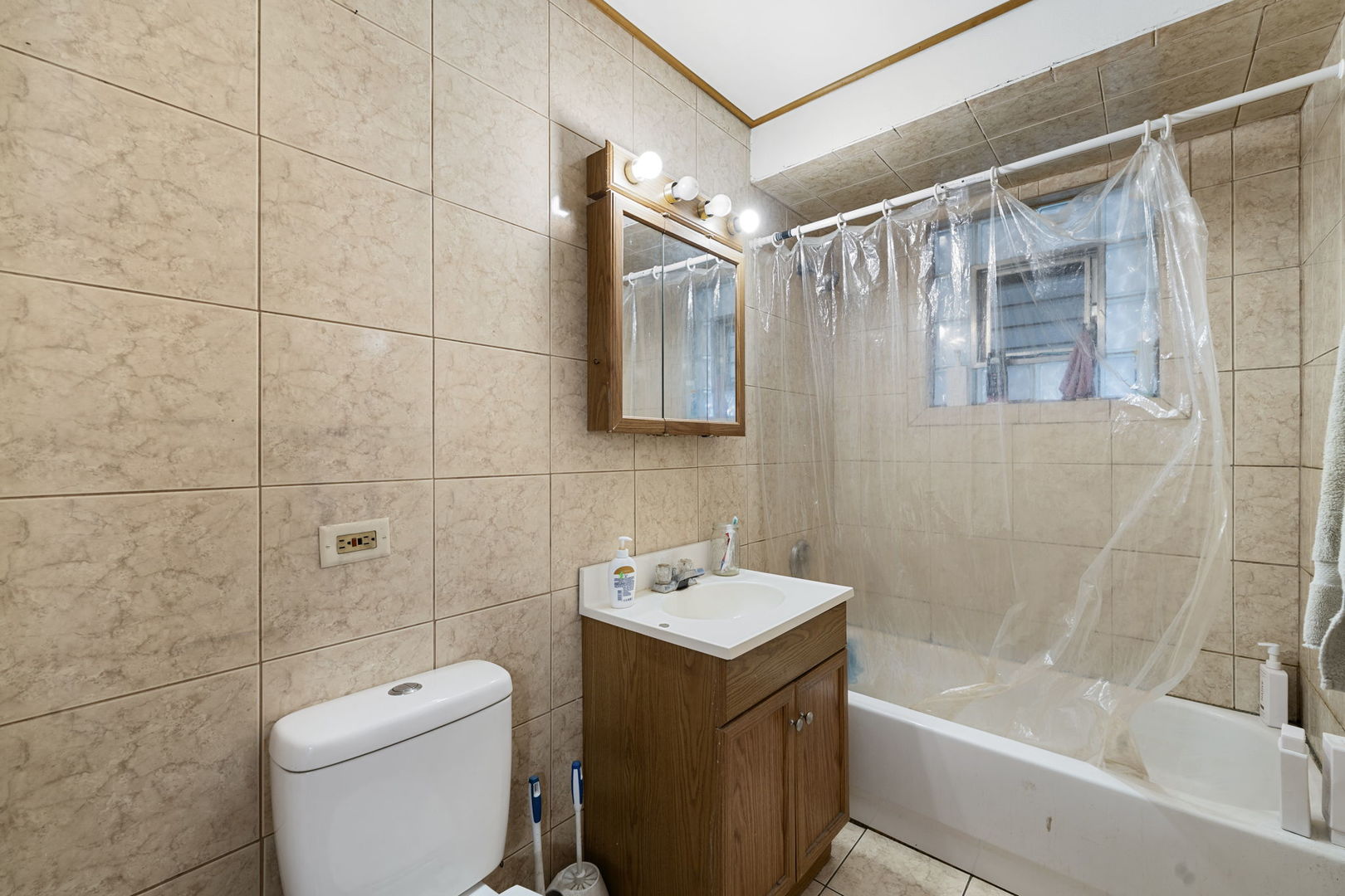 6021 South Archer Road Summit, IL 60501 - Photo 17 of 40 a bathroom with a sink a toilet and shower