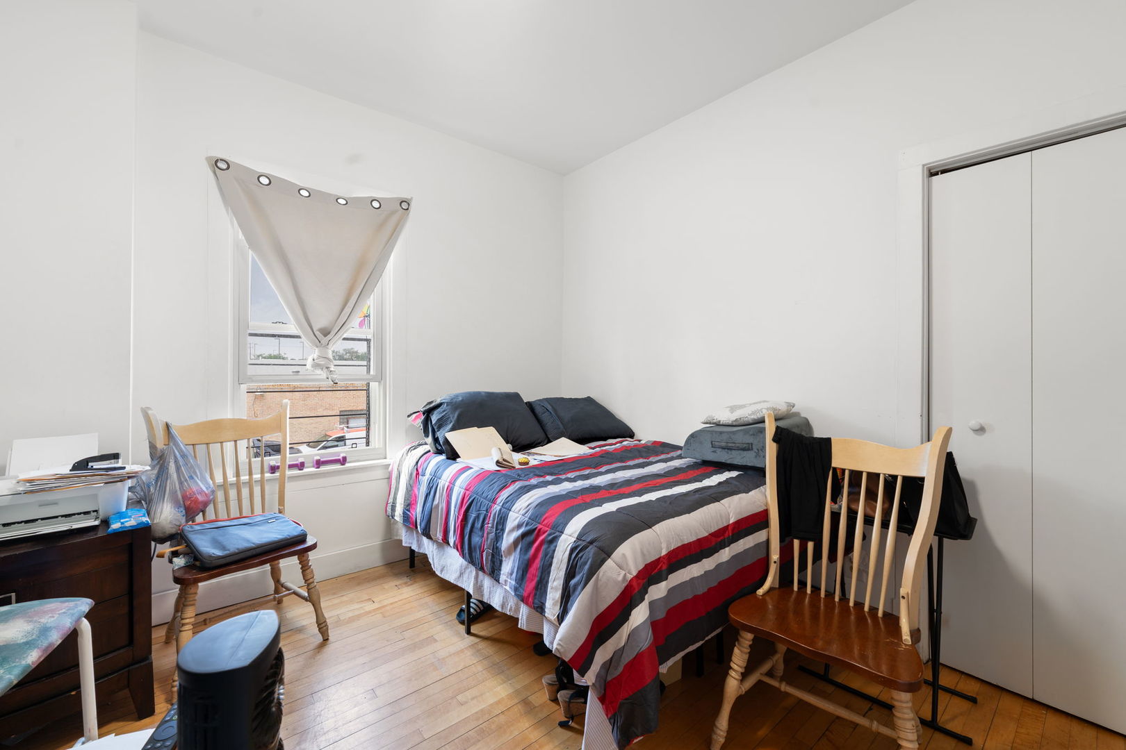 6021 South Archer Road Summit, IL 60501 - Photo 18 of 40 a bedroom with a bed and wooden floor