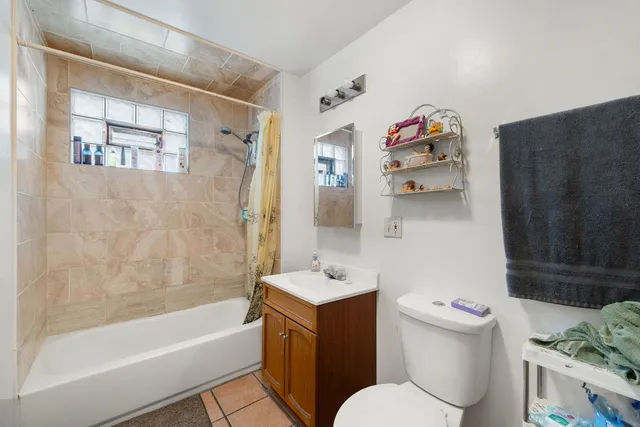 a bathroom with a bathtub toilet and sink