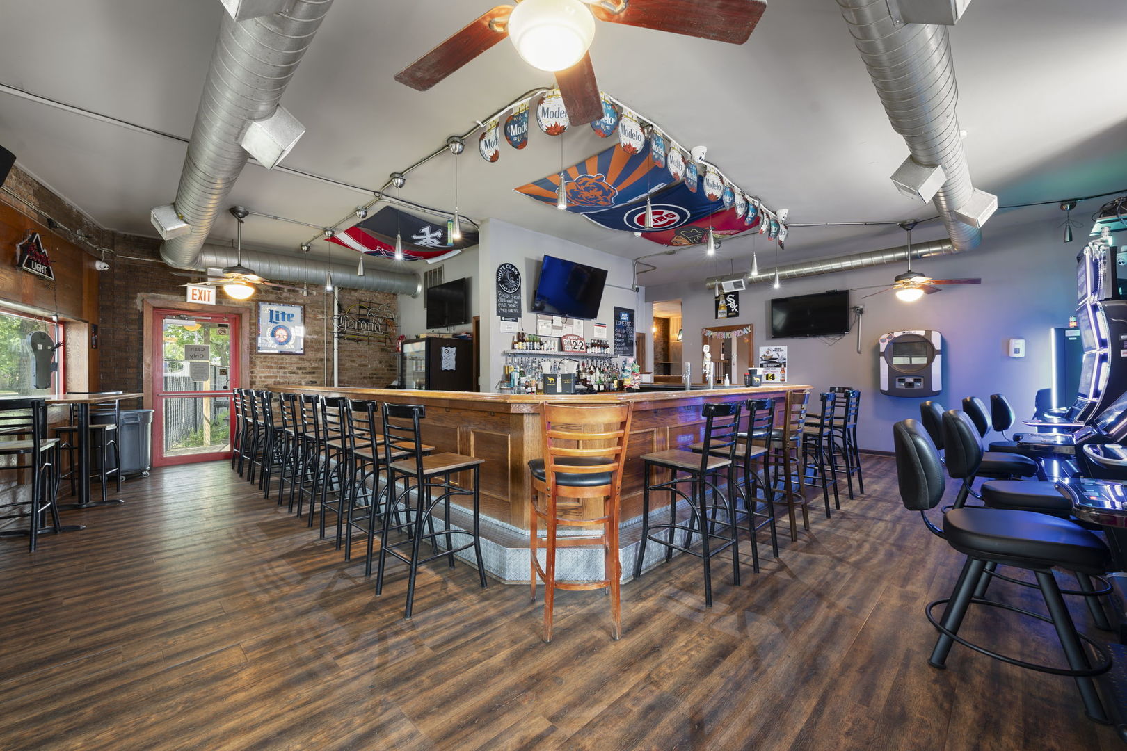 6021 South Archer Road Summit, IL 60501 - Photo 21 of 40 a living room with lots of furniture and kitchen view