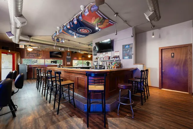 a view of a dining area with furniture and wooden floor